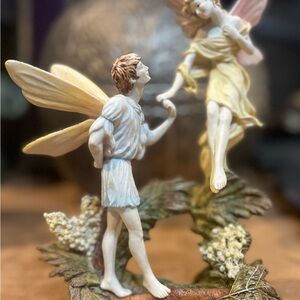 Charming Fairy Figurine with Yellow and Cream Accents